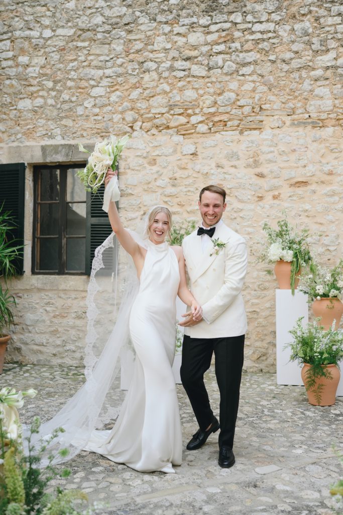 Sophie and Rory stepping out into the stone courtyard at Finca Morneta