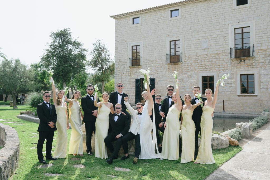 The couple and their wedding party in front of Finca Morneta